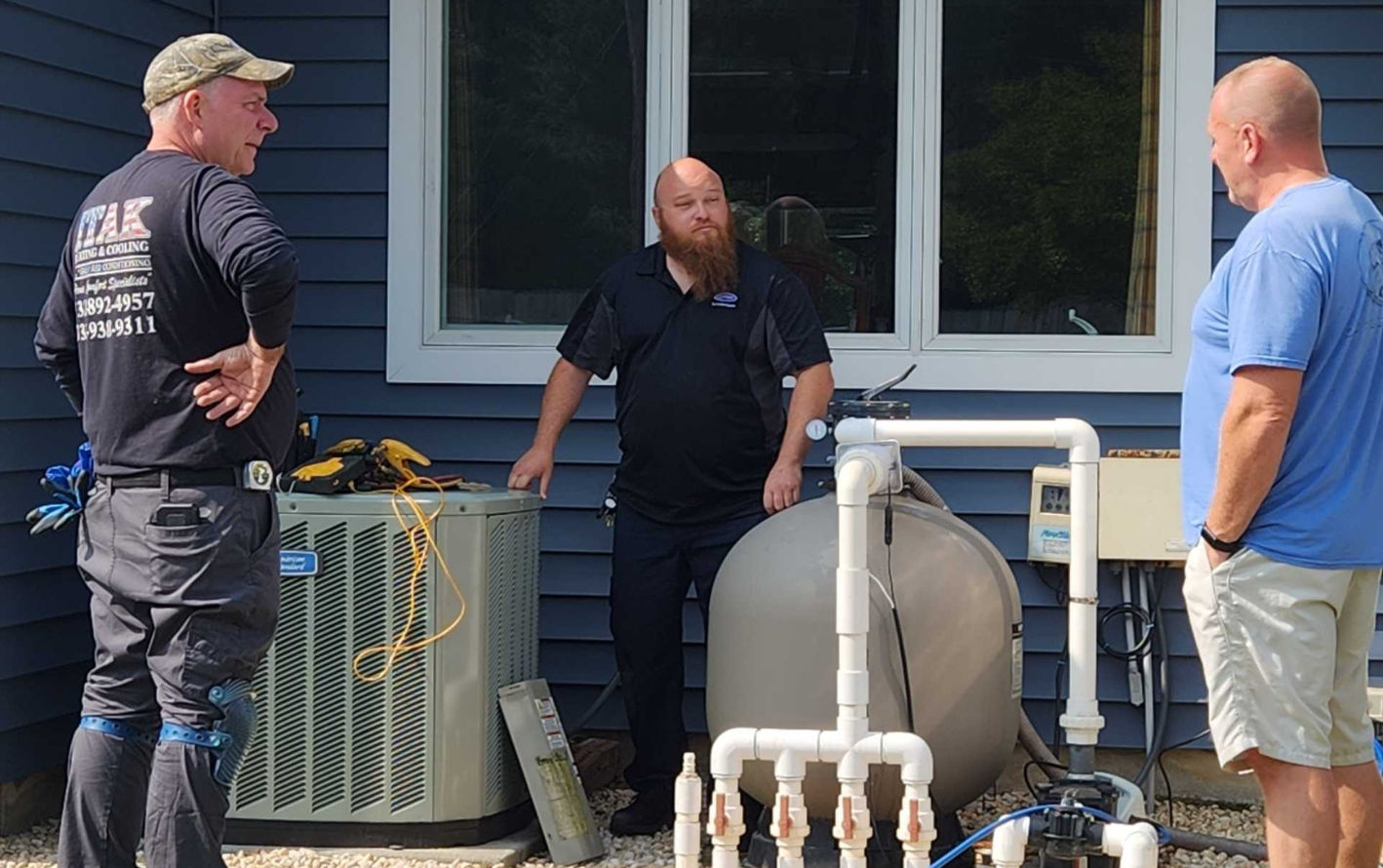 HVAC Job Costing: HVAC technicians talk with homeowner