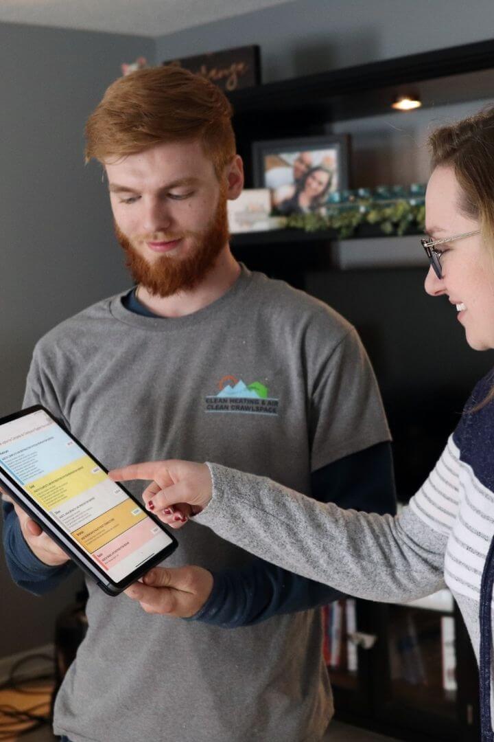 Technician presenting pricing menu to customer